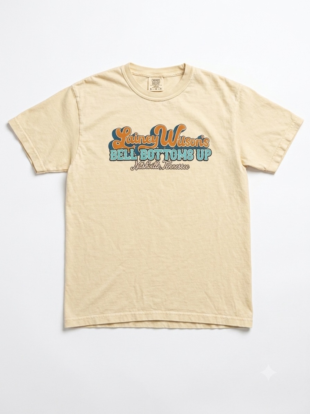 Lainey Wilson’s Bell Bottoms Up Graphic Tee on a Comfort Colors Tee
